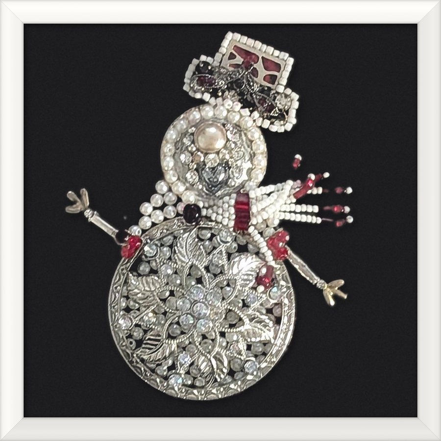 Snowman jewelry art in a white frame