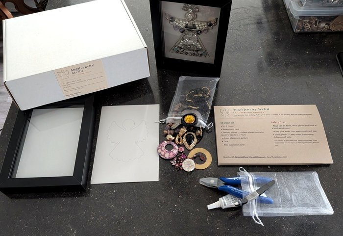 An angel jewelry art kit unpacked: frame, jewelry pieces, pattern and tools